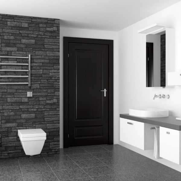 modern bathroom with black stone wall and white equipment
